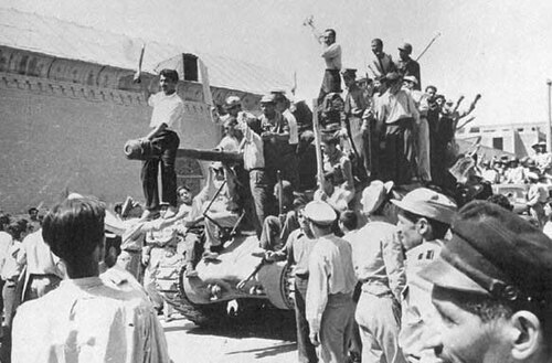 Pro-Shah crowds, many of whom were paid with CIA funds, take to the streets of Tehran on 19 August 1953.
