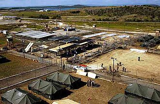 An overview of the outdoor wire-mesh cells of Camp X-Ray, photographed in 2002.