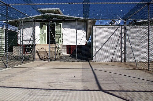 A small, sun-bleached recreation yard inside Camp Delta, pictured in 2002.