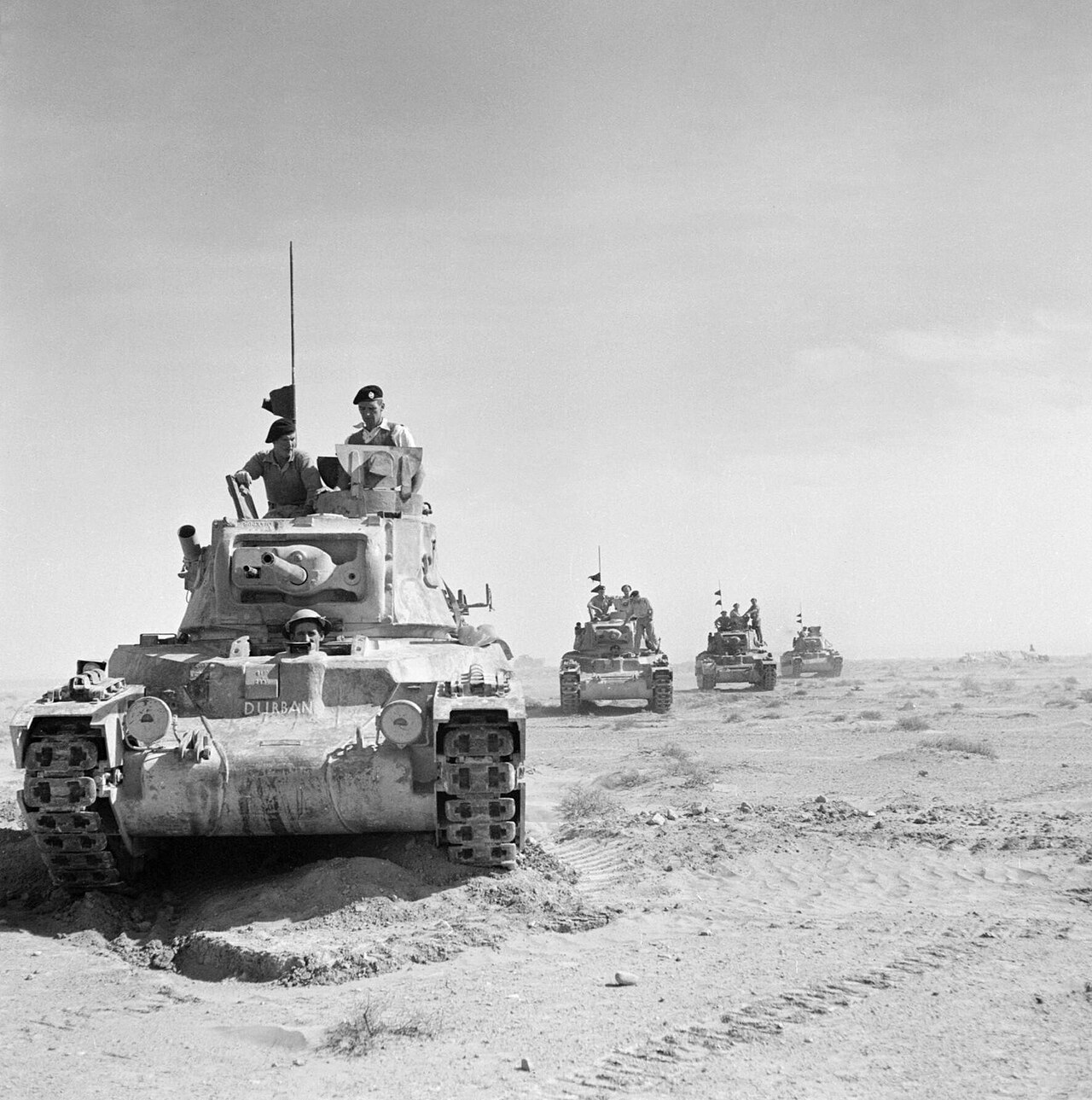 Armoured vehicles deployed in North Africa, a theatre shaped by imperial logistics and African non-combatant labour corps.